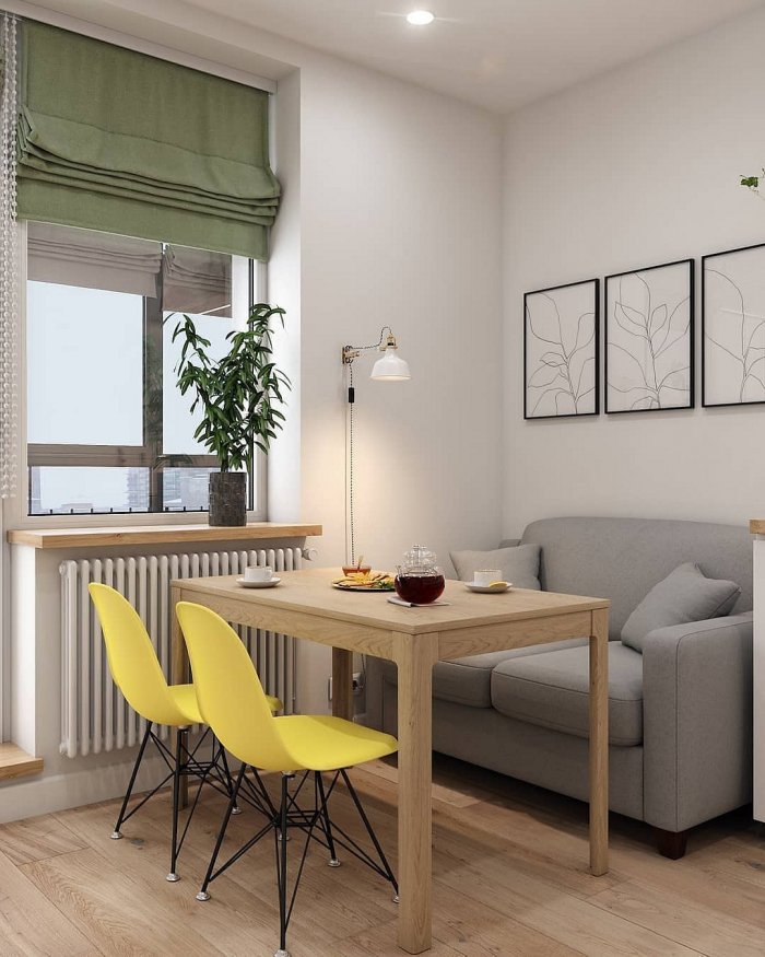 Интерьер квадратной кухни с диваном