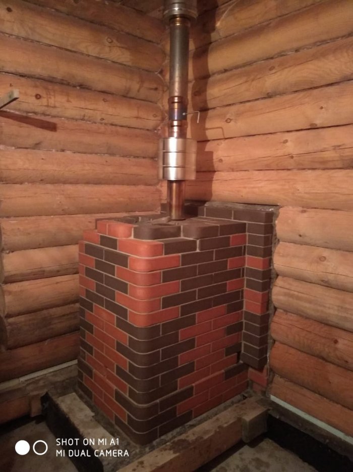 Банная печь Гефест обложенная кирпичом